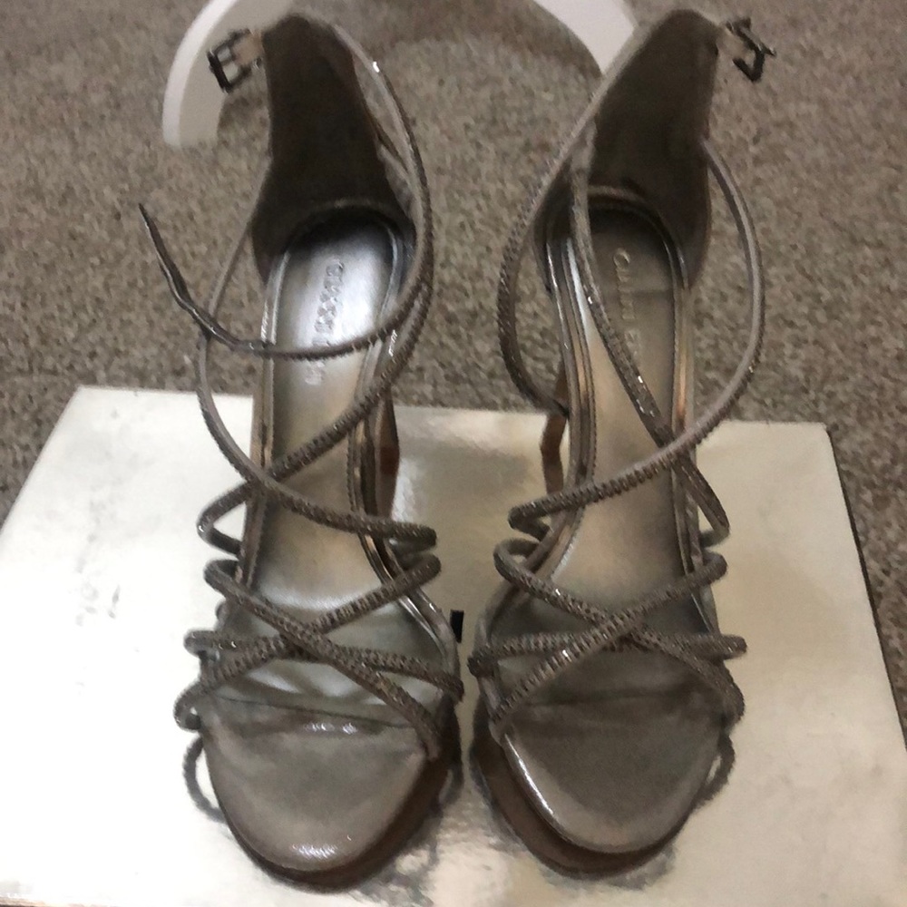 Super cute silver rhinestone detail strappy heels.  Only worn once